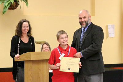 Image: Tanner Chambers earned 3rd place in the UIL’s 6th Grade Listening category. Chambers poses with Italy High School Principal Lee Joffre.