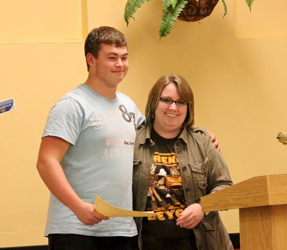 Image: With the school board observing, senior Zain Byers is presented his certificate of achievement from Catherine Hewitt for his 1st Place finish in the science fair.