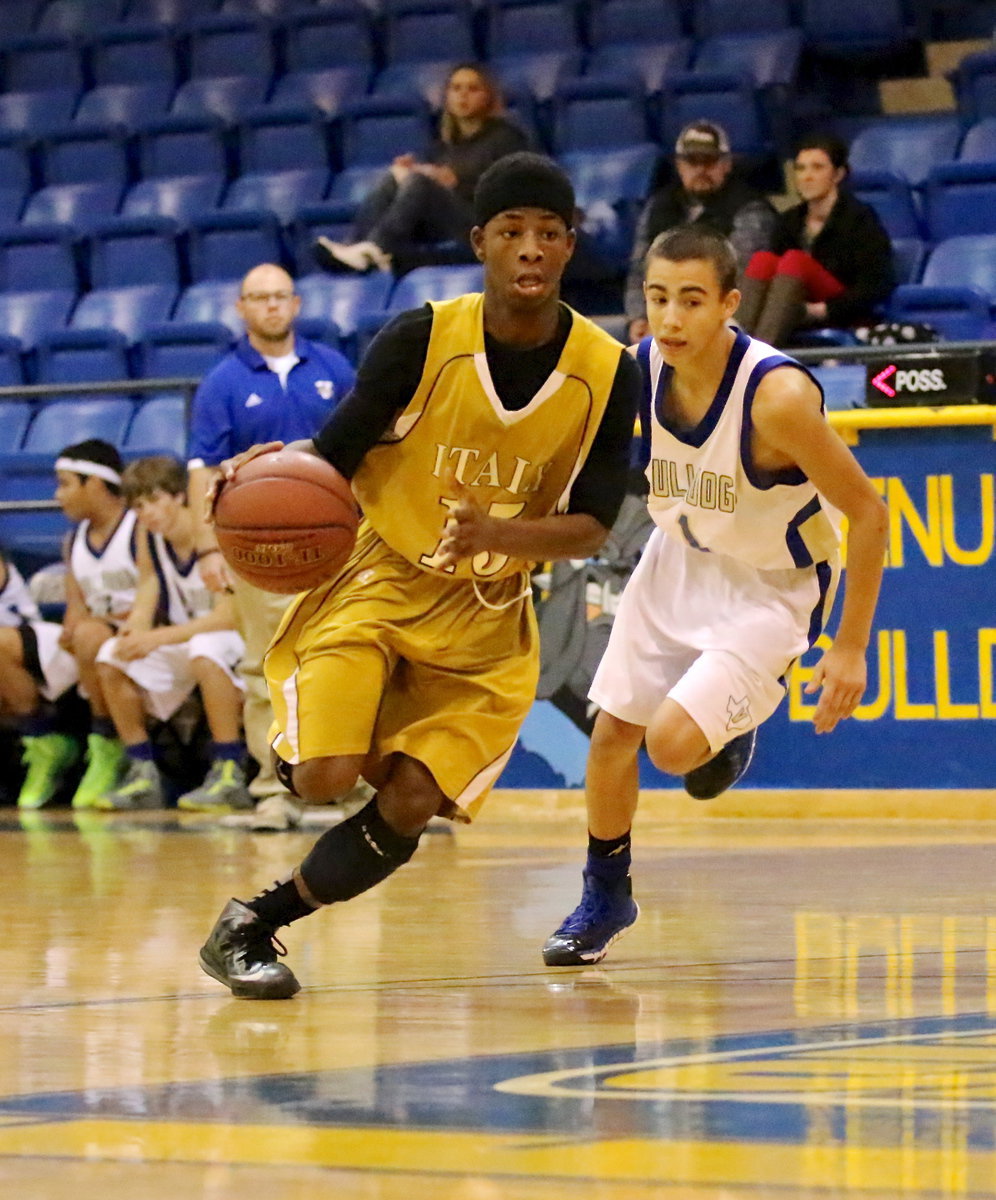 Image: Eric Carson(15) hustles the ball across half court during Italy’s JV game against Venus.