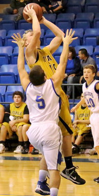 Image: Cody Boyd(15) just will not be denied near the basket.