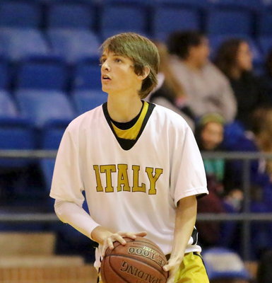 Image: Ty Windham(12) practices a jump shot during the pre-game of the varsity matchup between Italy and Venus.