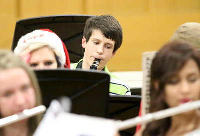 Image: Ty Hamilton helps lead the Junior High Band by playing the clarinet.