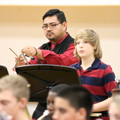 Image: Band director Jesus Perez chimes in with Tristan Smithwick and the Italy Junior High Band.