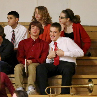 Image: Ben Latimer and Clay Riddle get a chance to watch the high school band perform.