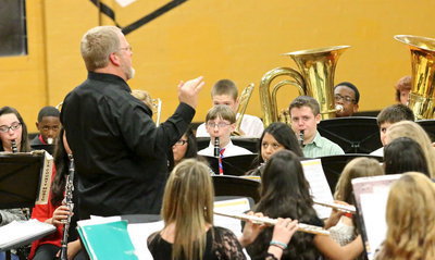 Image: Assistant band director David Graves leads the Jr. High band thru a couple of festive songs.
