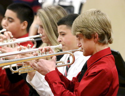 Image: Garrett Janek gives it his all along with his fellow trumpeters.