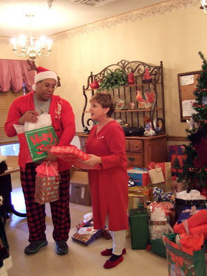 Image: Chris Baker and Ann Rayner are busy passing out gifts.