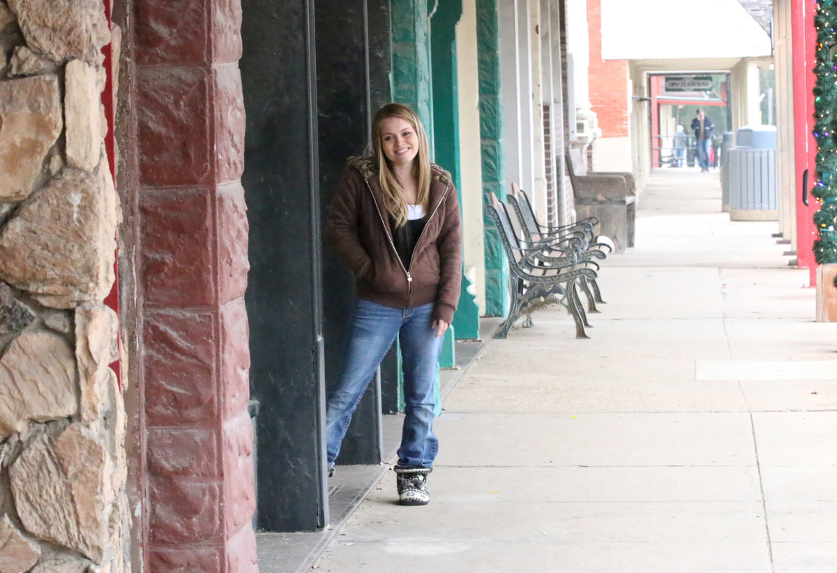 Image: Brittany steps out of her downtown flat to check out the parade.