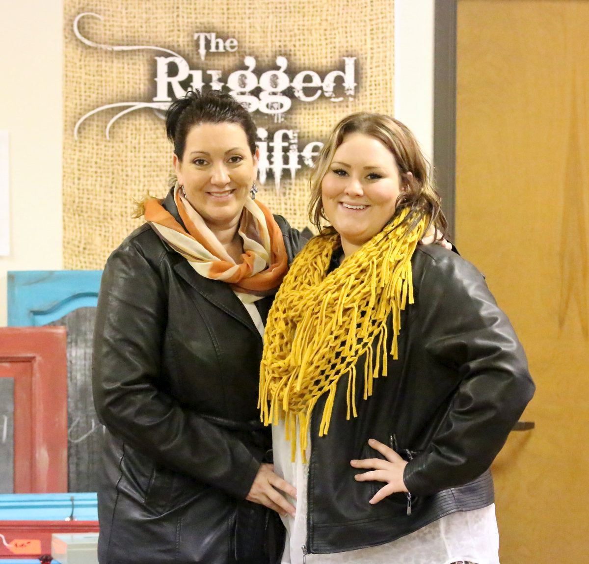 Image: Nancy Hinojosa with Tri-County Appliance, LLC Heating &amp; Air Conditioning-Italy poses with daughter Chelsea Beets in front of her crafts booth inside the Italy Community Center.