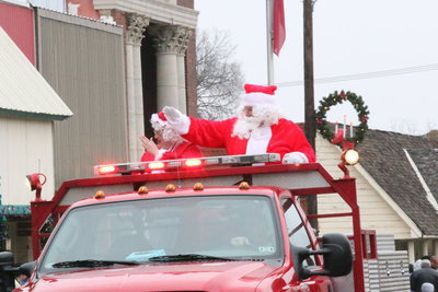 Image: Santa and Mrs. Claus, aka Donald and Karen Brummett, conclude the parade from the back of an Italy fire truck.
