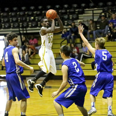 Image: Senior Gladiator TaMarcus Sheppard(10) puts in 2 of his 8-points against the Lions.