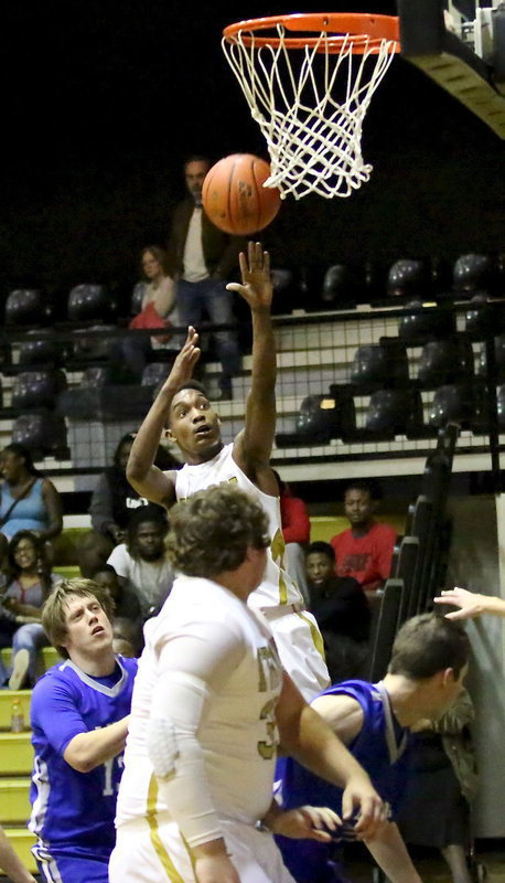 Image: Trevon Robertson(2) scores two of his 26-points to lead all scores. Robertson did most of his damage in the third period with 18-points including a 3-pointer.