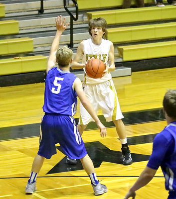 Image: Ty Windham(12) pulls the trigger on a three-ball that ties the game briefly before the end of the first-half.
