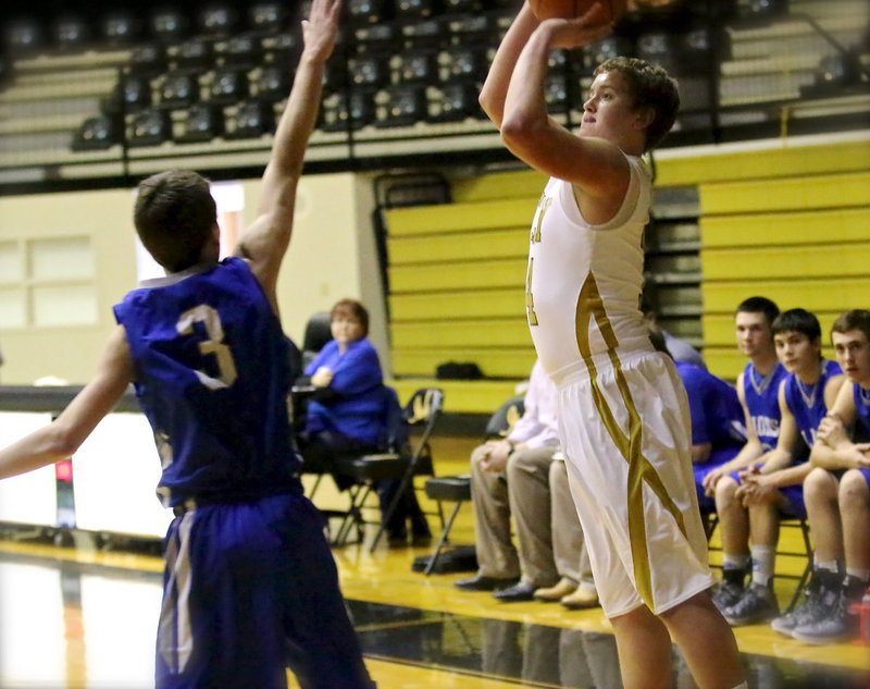 Image: Bailey Walton(14) pulls up for a shot from the corner.