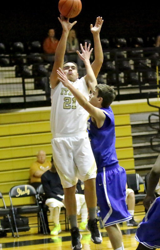 Image: JV Gladiator David De La Hoya(21) scores 2 of his 5-points over a Lion defender.