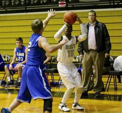 Image: Italy’s Eric Carson(15) knocks down a 3-pointer from the corner in the first-period against Blooming Grove.