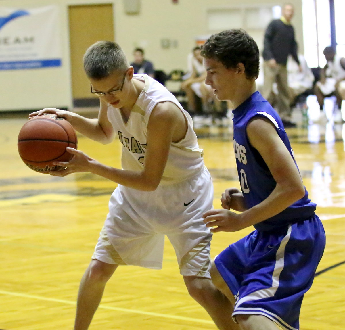 Image: JV Gladiator Hunter Ballard(1) tries to maneuver past a Lion defender.