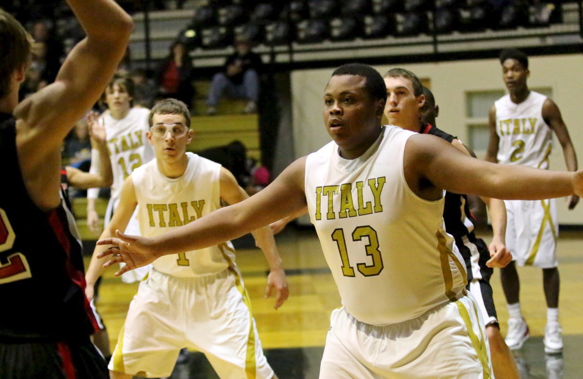 Image: Darol Mayberry(13) and Ryan Connor(1) close out on a West shooter.