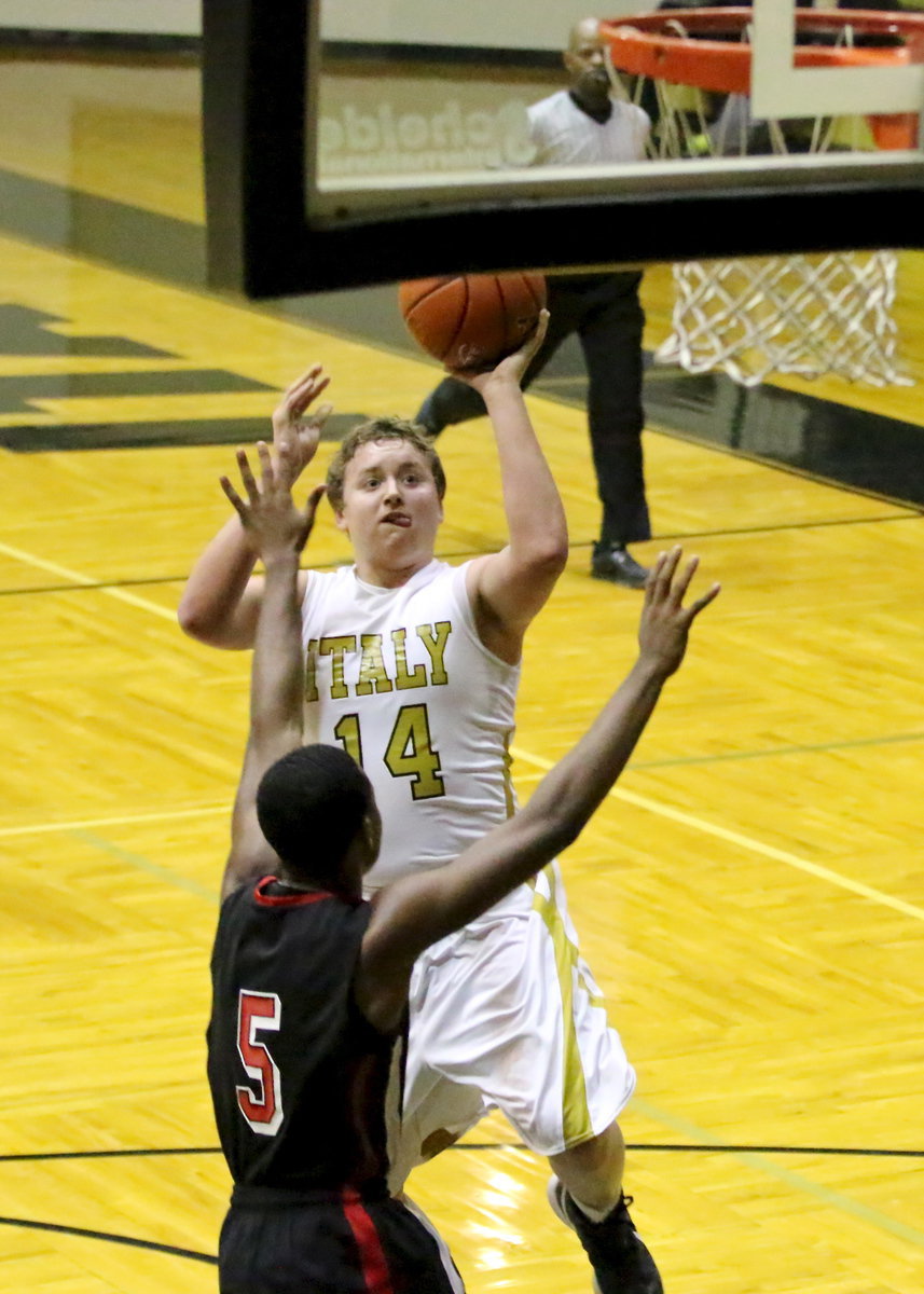 Image: Bailey Walton(14) rises to get off a shot over a West defender.