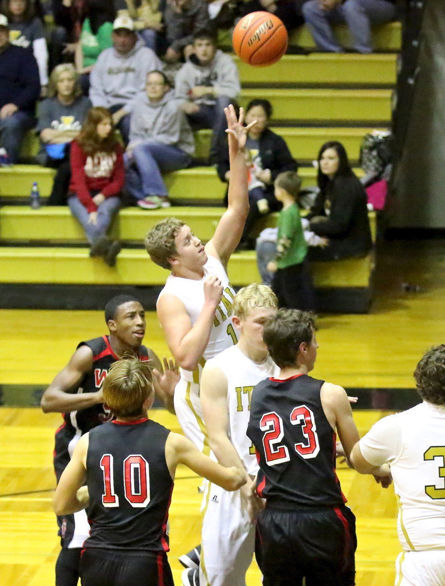 Image: Cody Boyd(4) clears space for teammate Bailey Walton(14) to put up a shot.