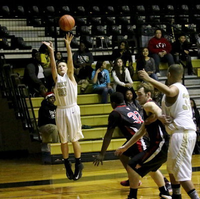 Image: Joshua Cryer(20) lets a 3-pointer fly with teammate Tristan Cotten(33) gaining inside position.