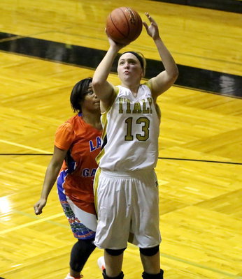 Image: Jaclynn Lewis(13) gets an open look at the basket.