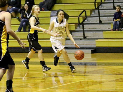 Image: Lizzy Garcia(25) drives toward the lane and puts up a short jumper.