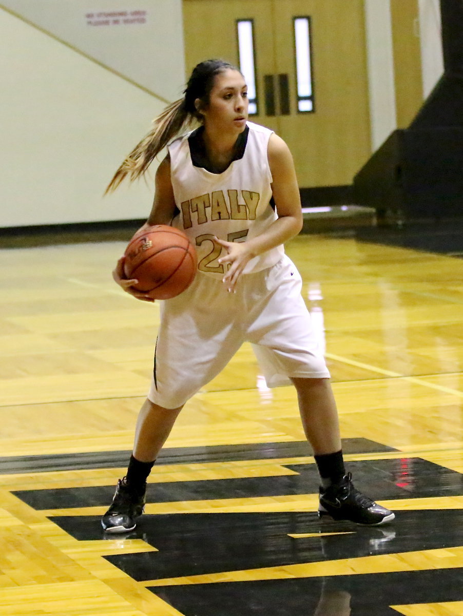 Image: Lizzy Garcia(25) secures the ball as she looks for an open teammate.