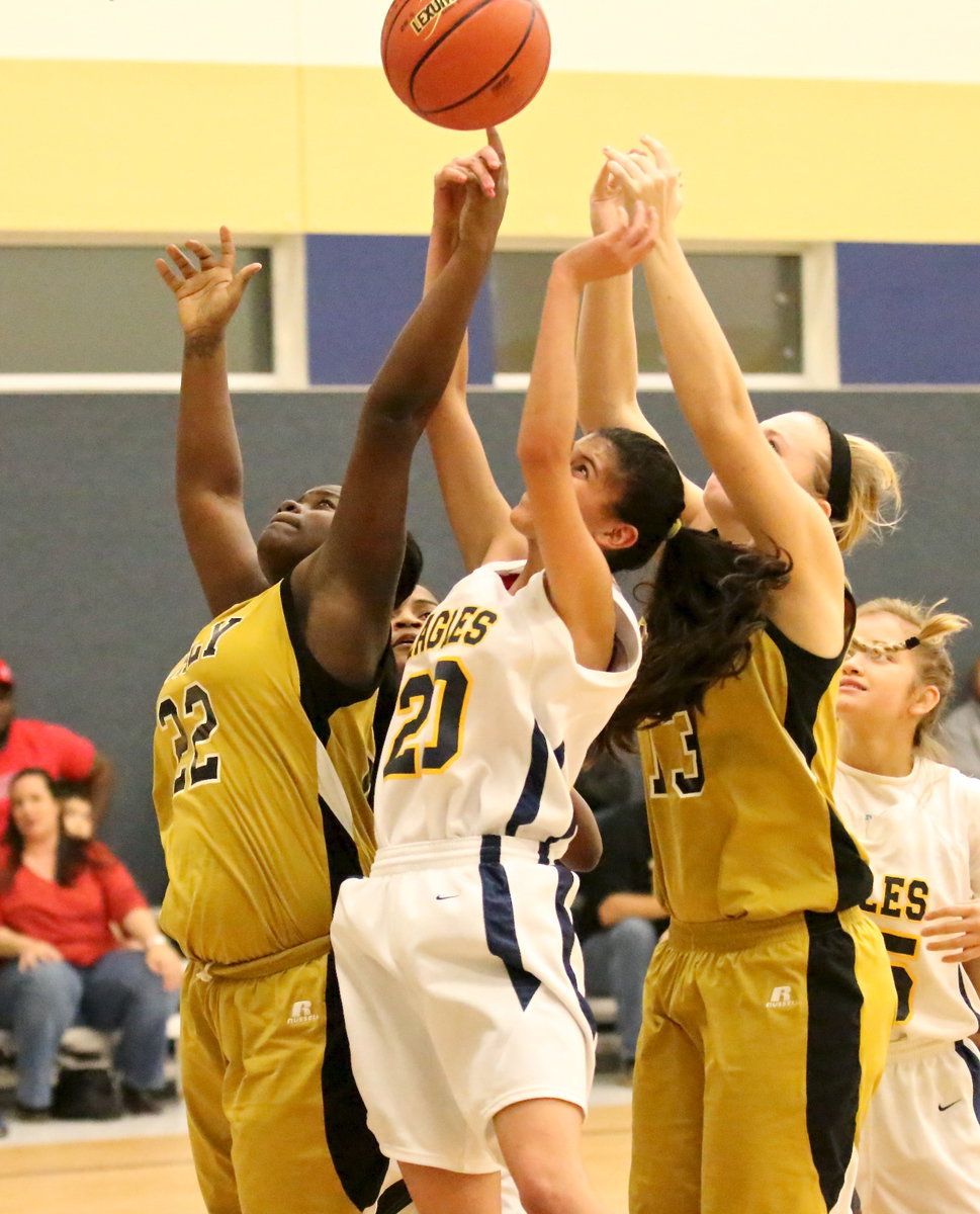 Image: Lady Gladiators Taleyia Wilson(22) and Jaclynn Lewis(13) fight for a rebound.