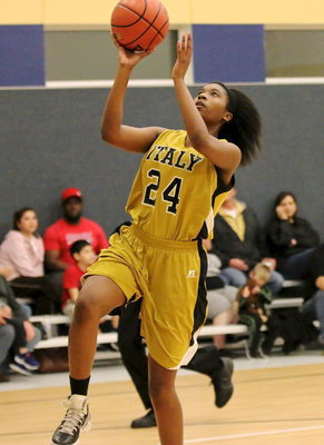 Image: Janae Robertson(24) adds a fast break bucket for the Lady Gladiator cause.