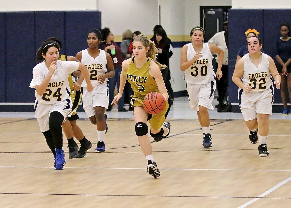 Image: Halee Turner(5) eludes a flock of Eagles on her way to the hoop.