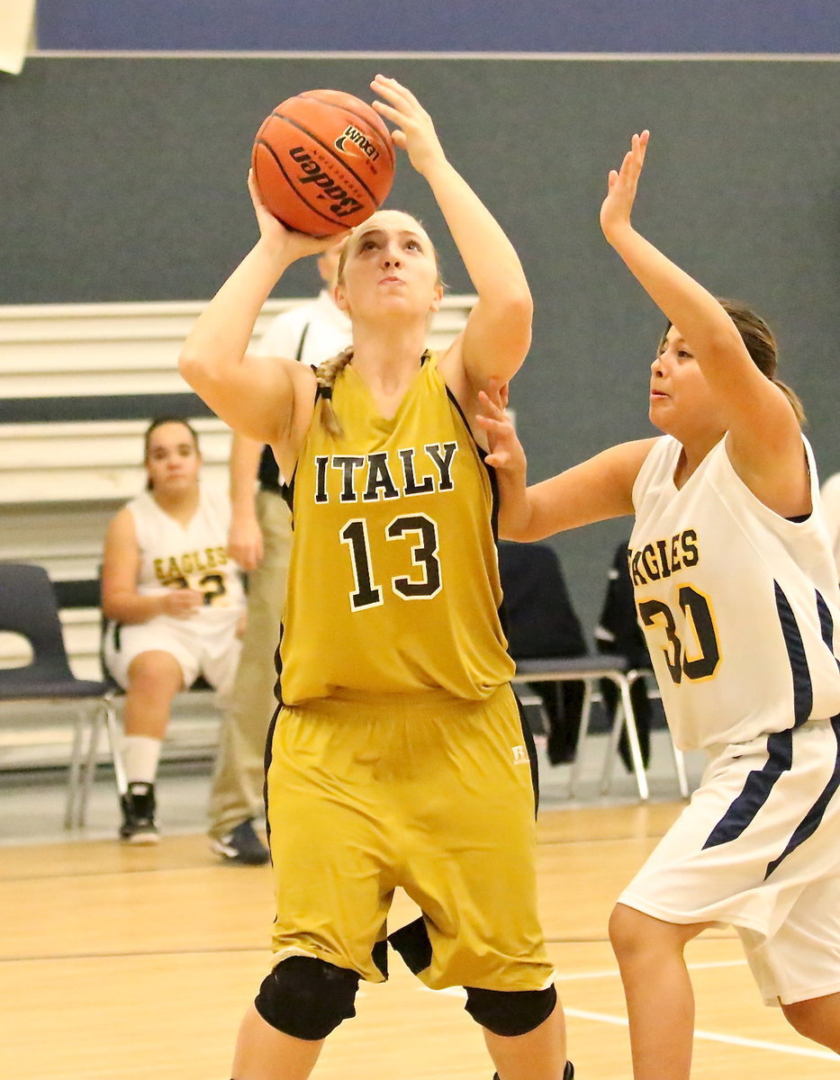 Image: Jaclynn Lewis(13) scores from the low block for Italy.