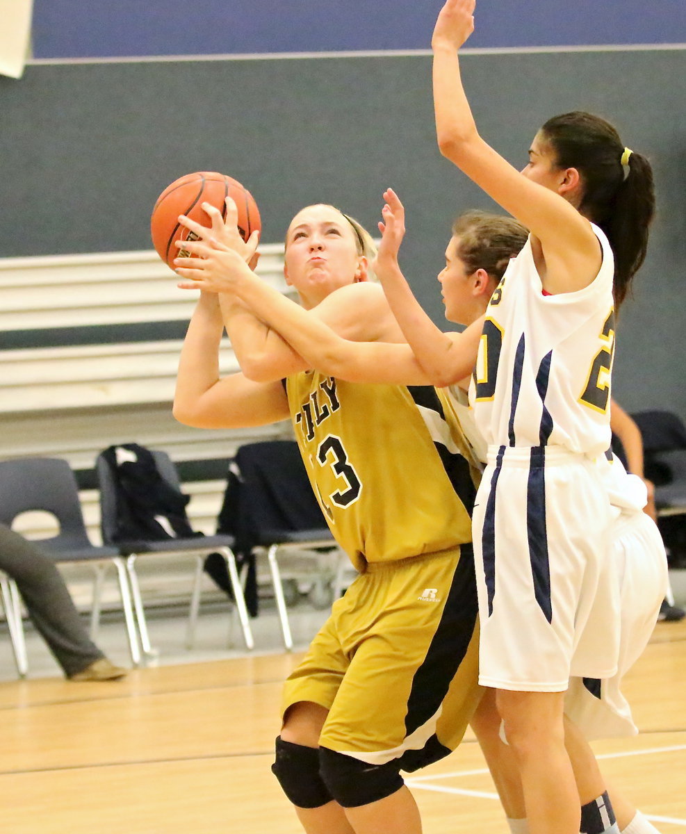 Image: Jaclynn Lewis(13) draws a hard foul while scoring inside and then steps to the line and makes the and-1.