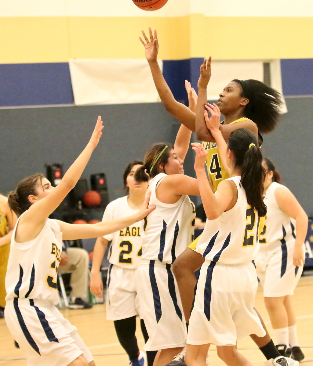 Image: Janae Robertson(24) attacks the goal and draws a shooting foul. She split the foul shots and finished the night with 5-points.