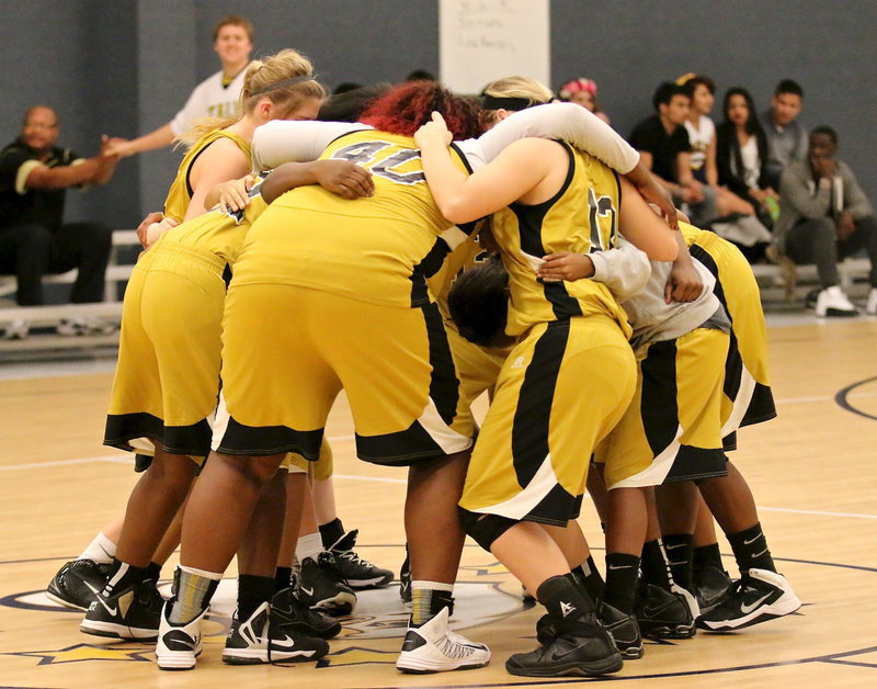 Image: All in! The Lady Gladiators celebrate their 67-6 win over Grand Prairie Advantage and are now 2-1 in district play.