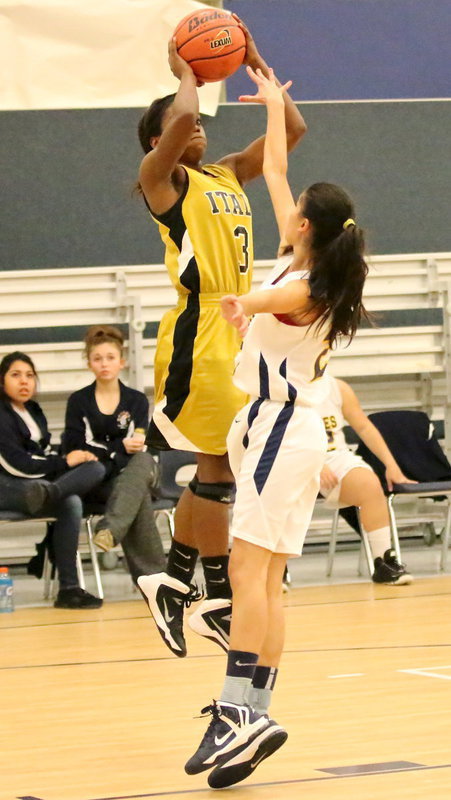 Image: Kortnei Johnson(3) had her jump shot dropping early.