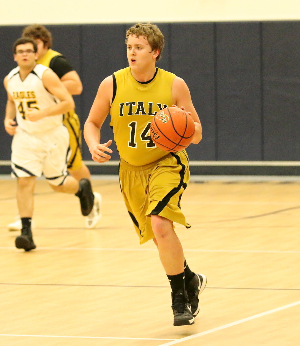 Image: Gladiator Bailey Walton(14) hurries the ball up the court.