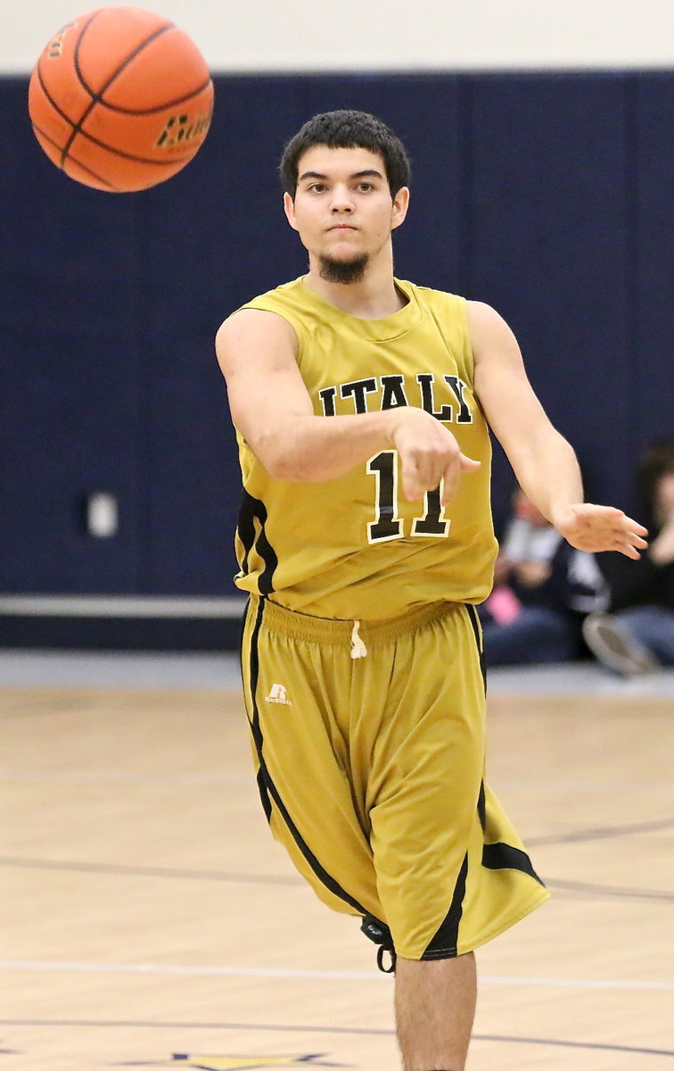 Image: Tyler Anderson(11) passes the ball ahead to a teammate.