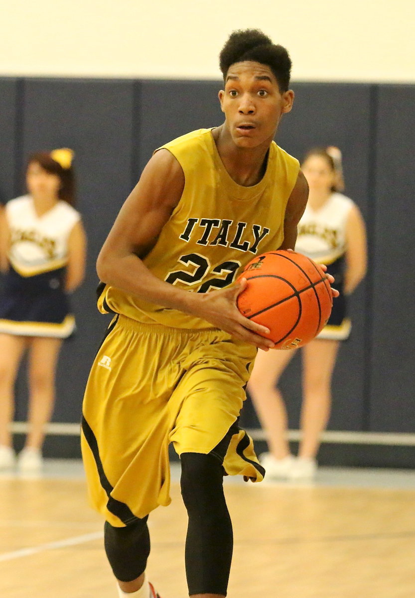 Image: Trevon Robertson(22) passes the ball ahead to a teammate.