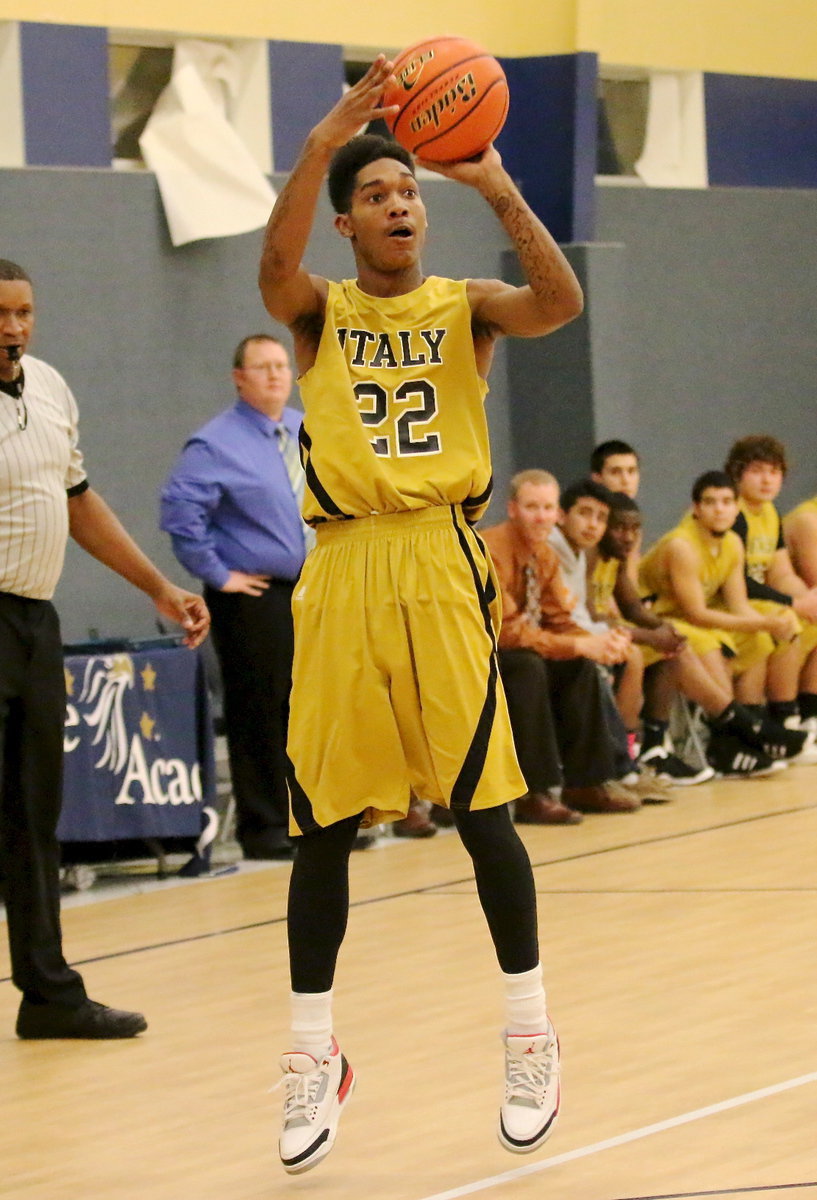 Image: Tre Robertson(22) pulls up for a jumper from the outside.