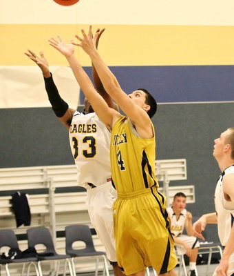 Image: Mason Womack(4) goes after a rebound.