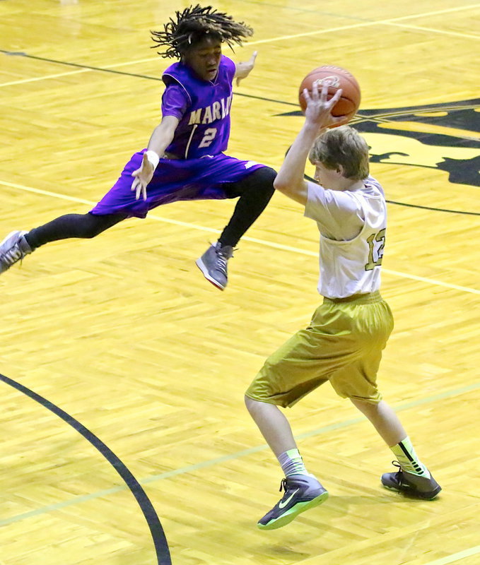 Image: Garrett Janek(12) avoids a flying Marlin while looking to pass.