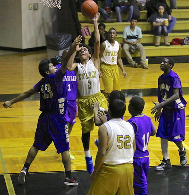 Image: Tylan Wallace(2) drives into the lane for a score.