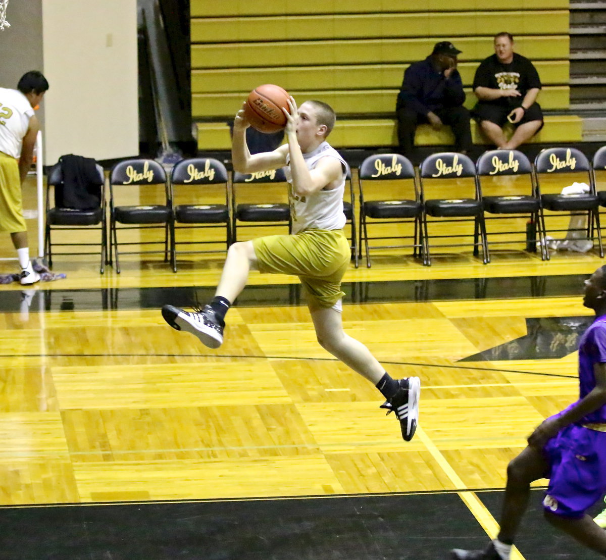 Image: Going in for another dunk is Italy 8th grader, Clay Riddle(30).