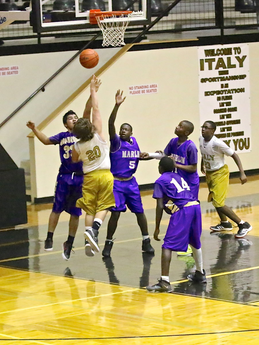 Image: Cade Roberts(20) scores over a couple of Marlin defenders.