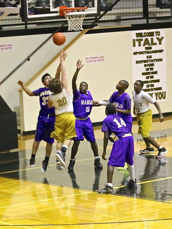 Image: Cade Roberts(20) scores over a couple of Marlin defenders.