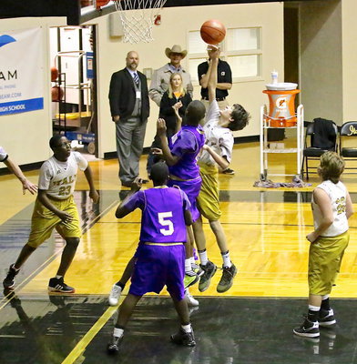 Image: Ty Hamilton(11) skies for an offensive rebound.