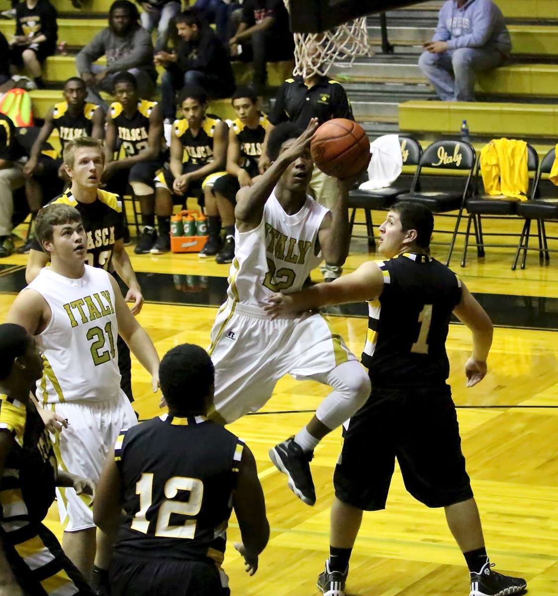 Image: Trevon Robertson(22) attacks the basket with Gladiator gusto.