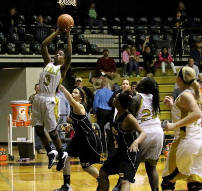 Image: Kortnei Johnson(3) overcomes to score the basket.