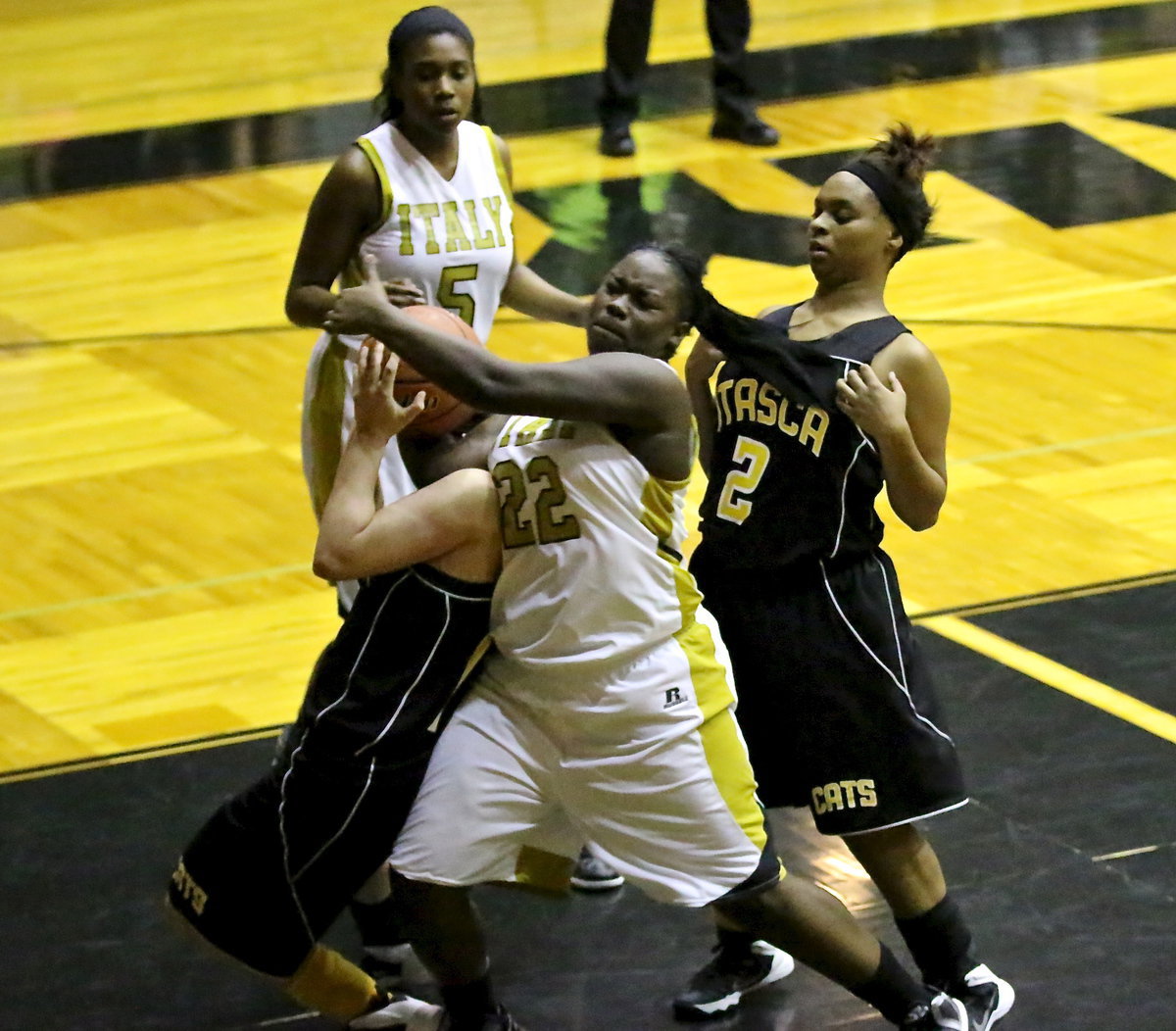 Image: Lady Gladiator, Taleyia Wilson(22) sends an early message to Itasca that the war is on. Italy out muscled and out pointed their district rival for a 65-43 win.